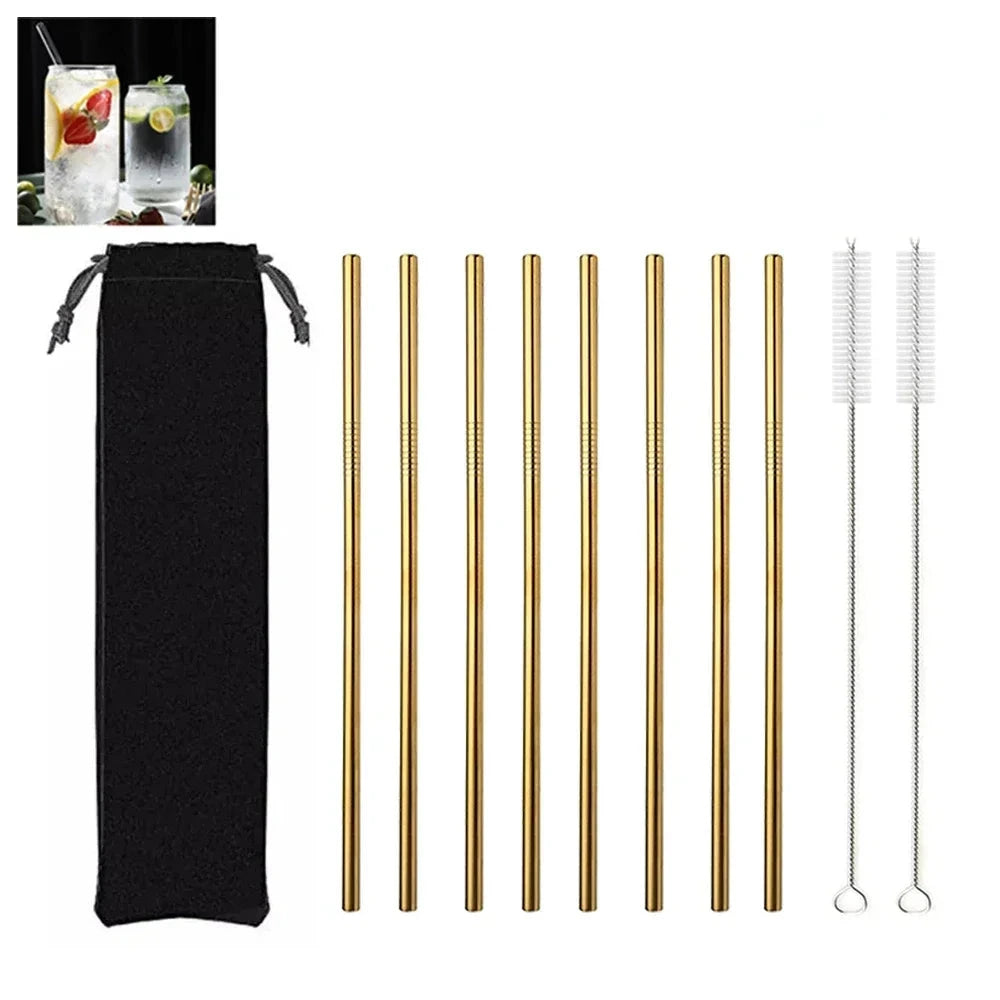 Set of gold metal straws with a black pouch and cleaning brush on a white background.